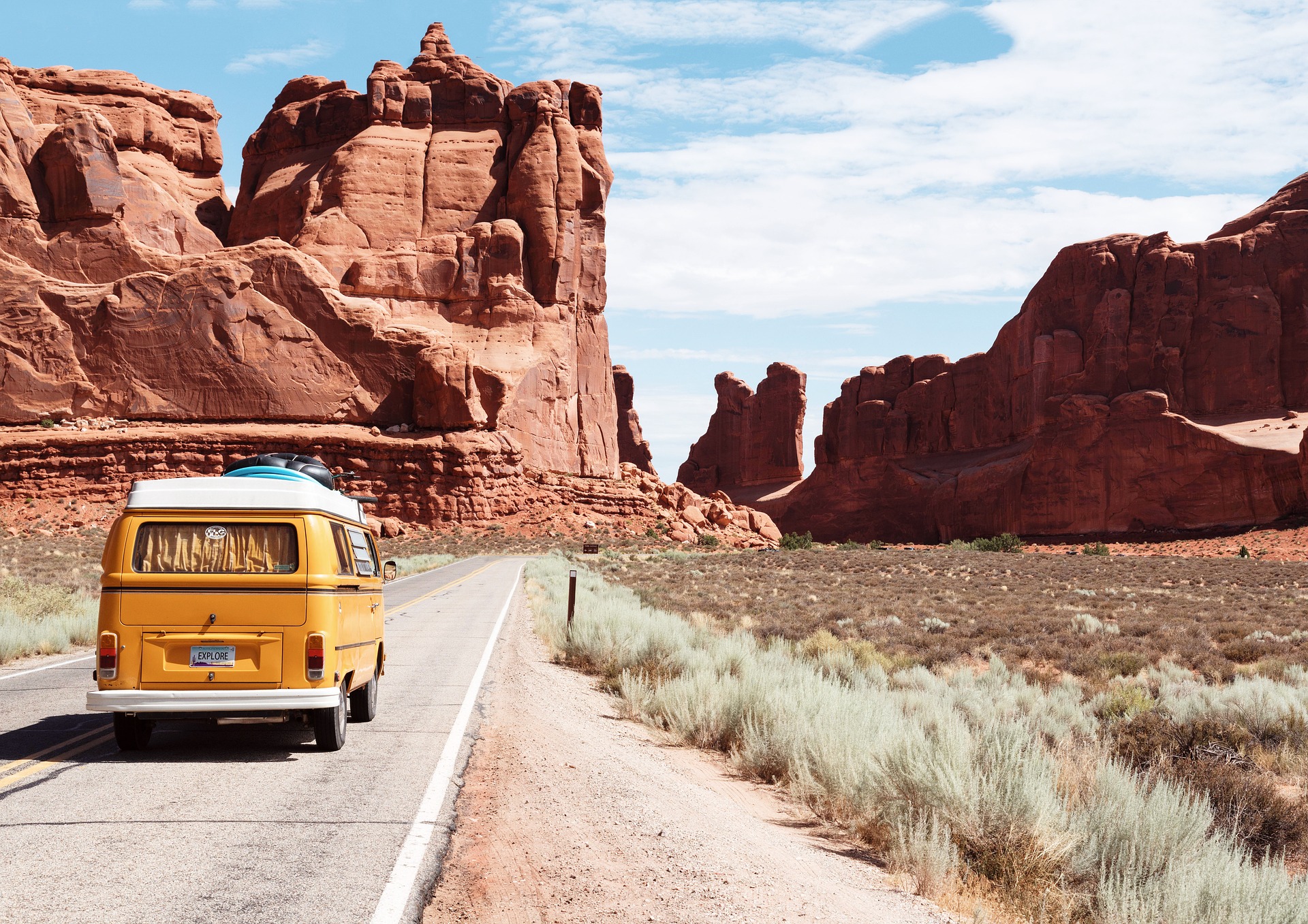Yellow bus traveling through Arches National Park