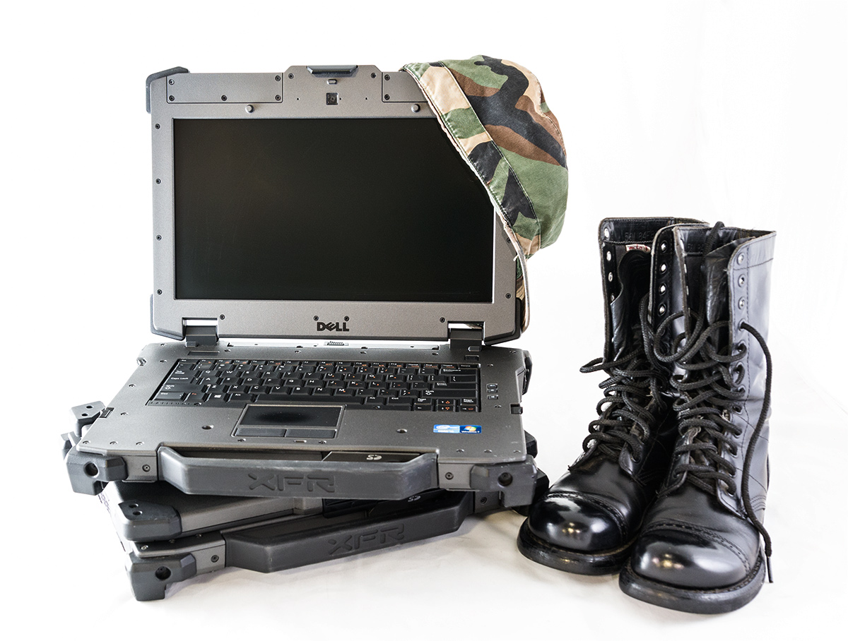 Dell XFR next to military boots 